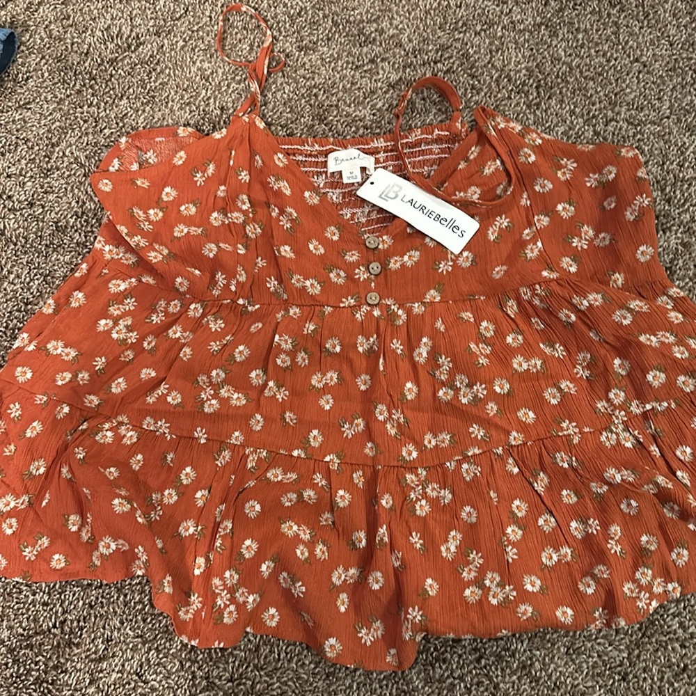 Orange tank with flowers. Tags on never worn .